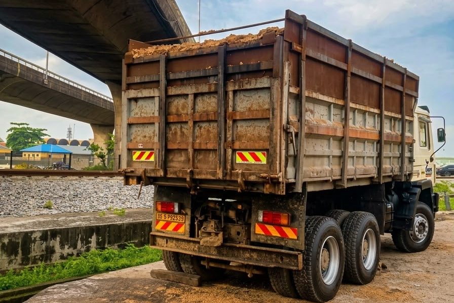 Nartar Ventures truck loaded with spent grain beside a Lagos flyover
